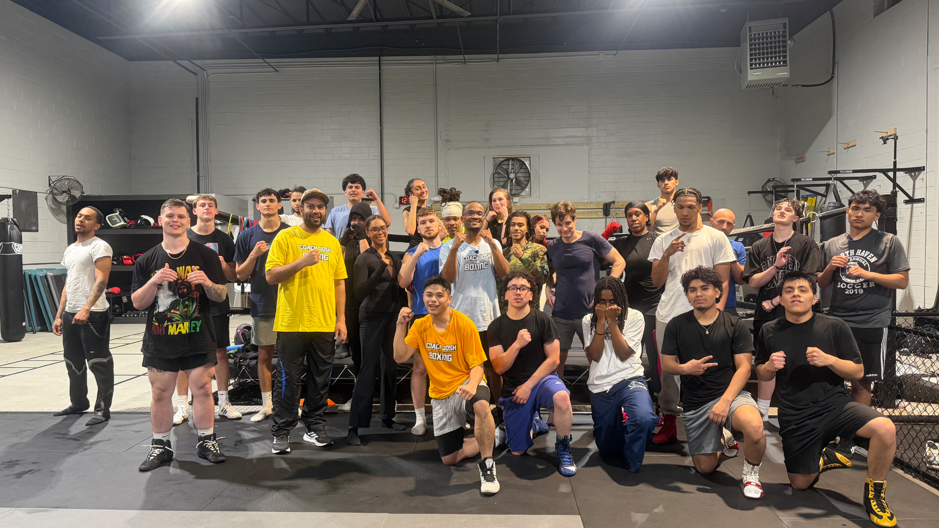 Large group of Coach Josh Boxing athletes posing together in the Hamden, CT gym