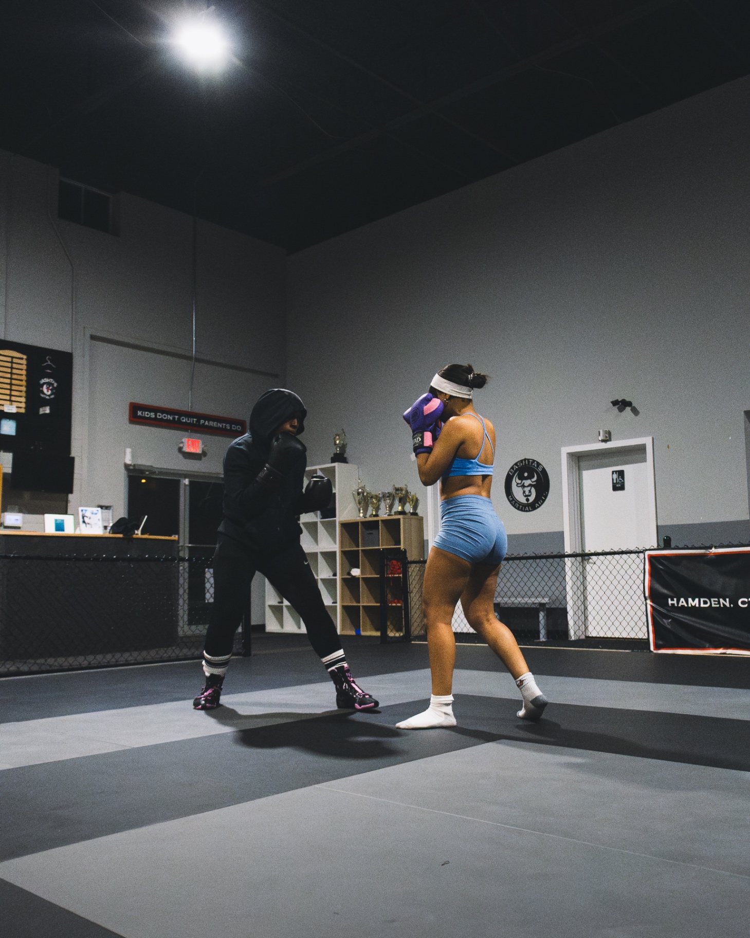 Two women sparring inside the Coach Josh Boxing gym in Hamden, CT